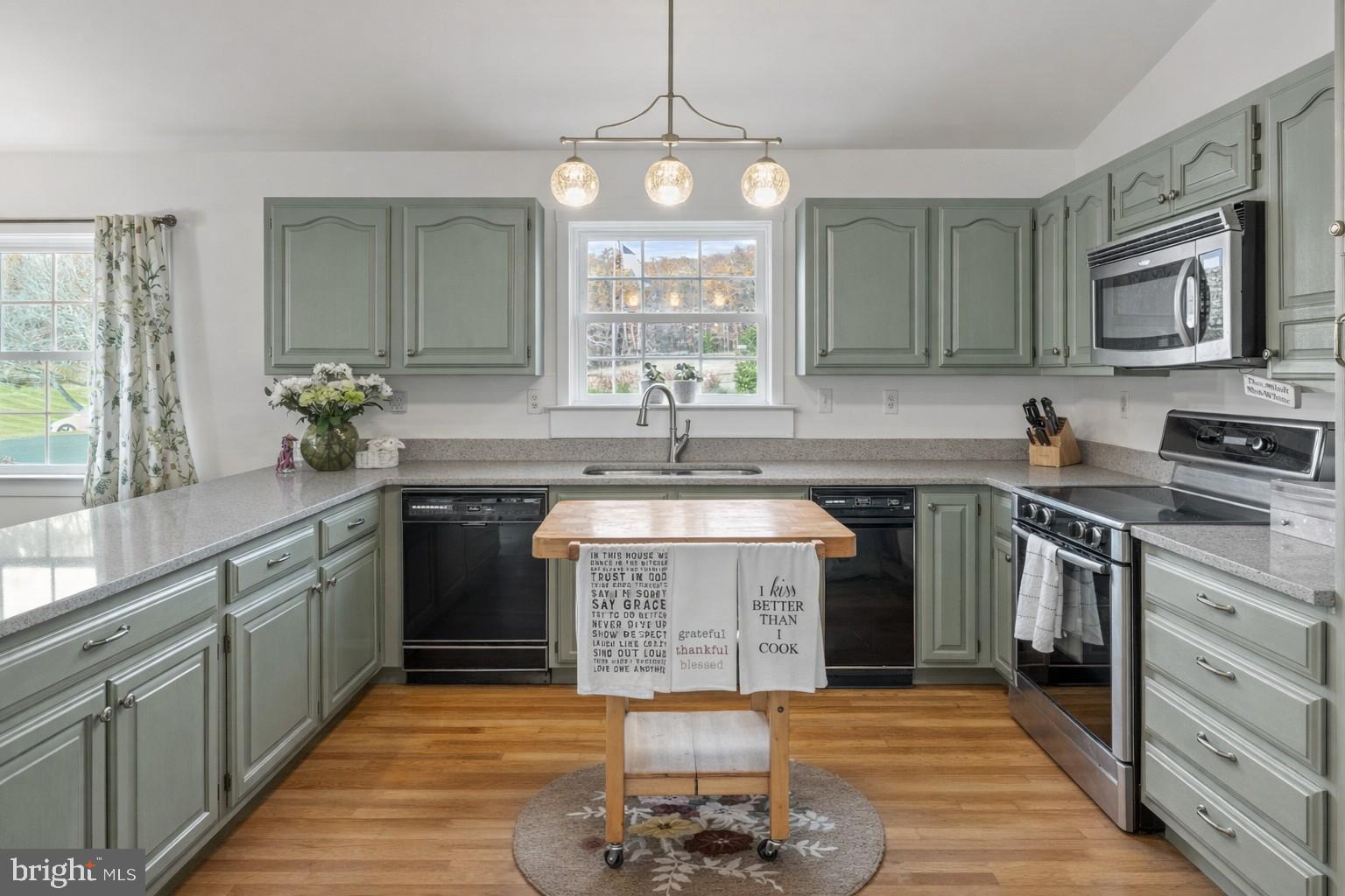 65 Chestnut Rail Lane Madison, VA 22727 - Photo 6 of 50 a kitchen with a sink stove and cabinets