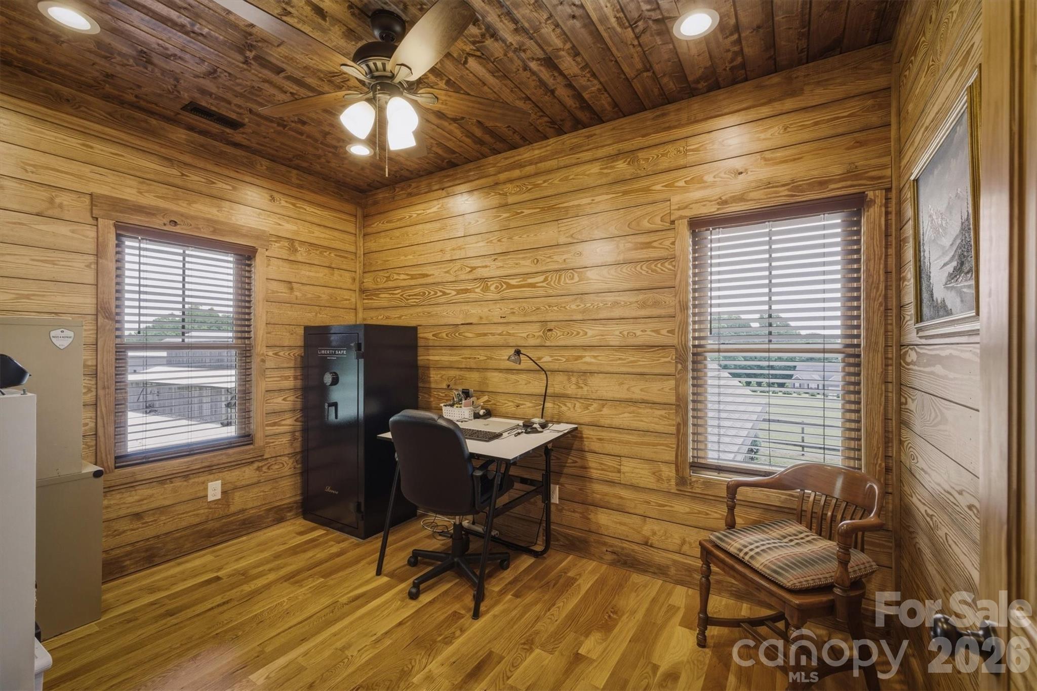 7490 Oak Ridge Church Road Connelly Springs, NC 28612 - Photo 27 of 44 a view of a workspace with furniture and a window