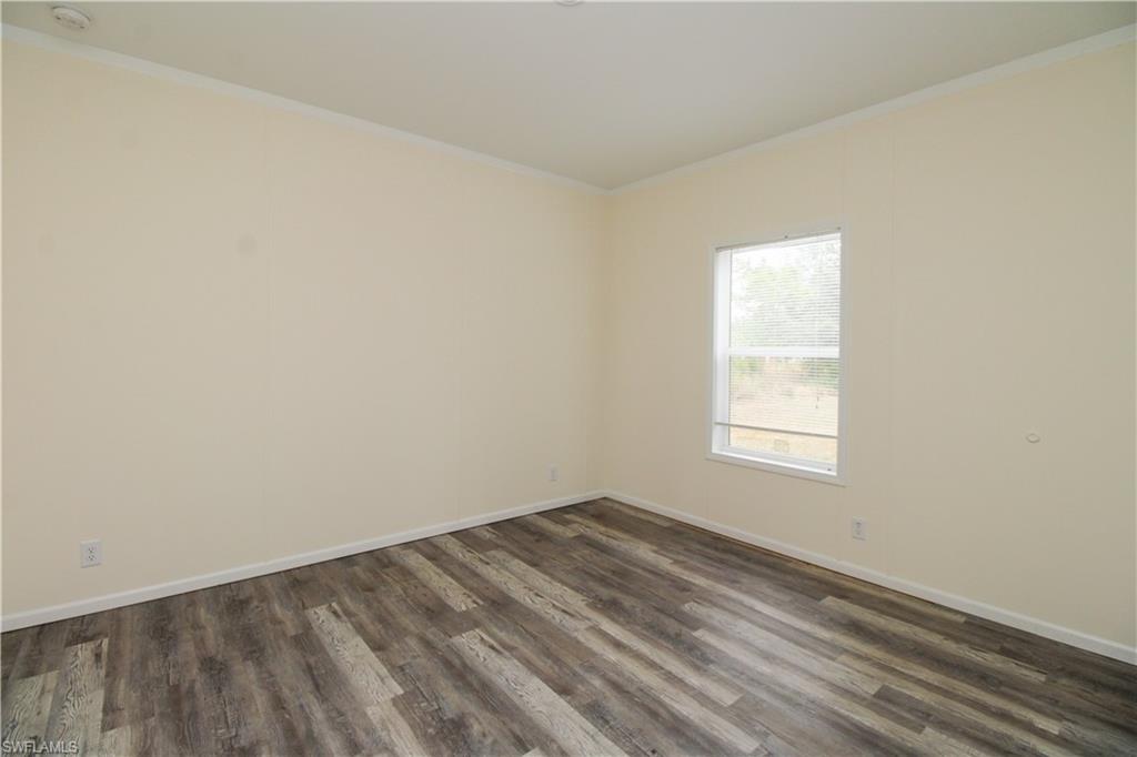 4660 43rd Avenue Northeast Naples, FL 34120 - Photo 19 of 44 an empty room with a window