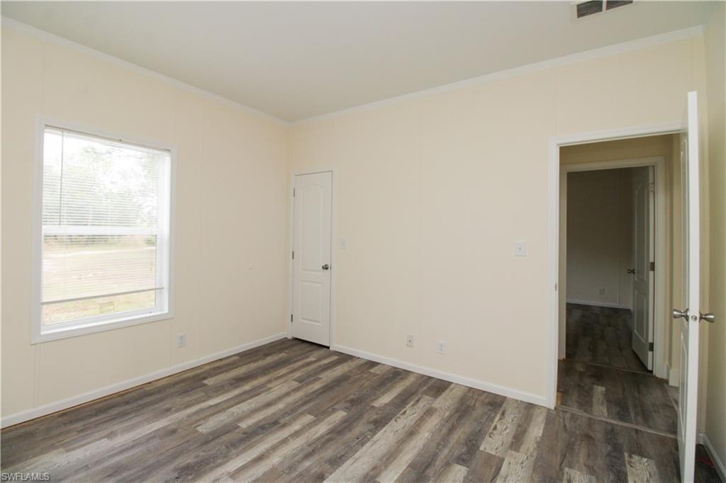 4660 43rd Avenue Northeast Naples, FL 34120 - Photo 20 of 44 an empty room with a window
