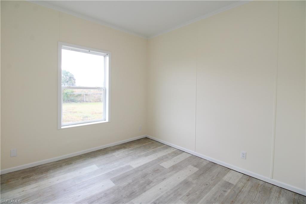 4660 43rd Avenue Northeast Naples, FL 34120 - Photo 25 of 44 an empty room with a window