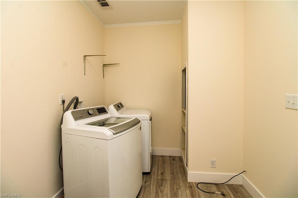 4660 43rd Avenue Northeast Naples, FL 34120 - Photo 29 of 44 a utility room with dryer and washer
