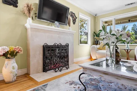 a kitchen with stainless steel appliances a stove sink microwave and cabinets