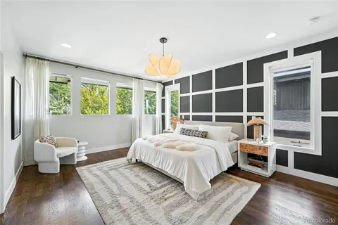 a bedroom with a large bed and a window