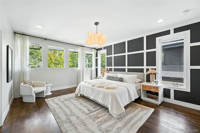 a bedroom with a large bed and a window