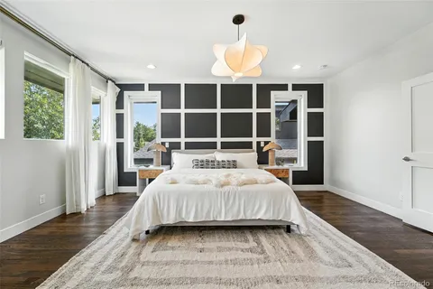 a bedroom with a large bed and a window