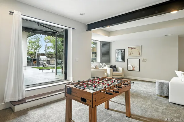 a living room with a rug and a table