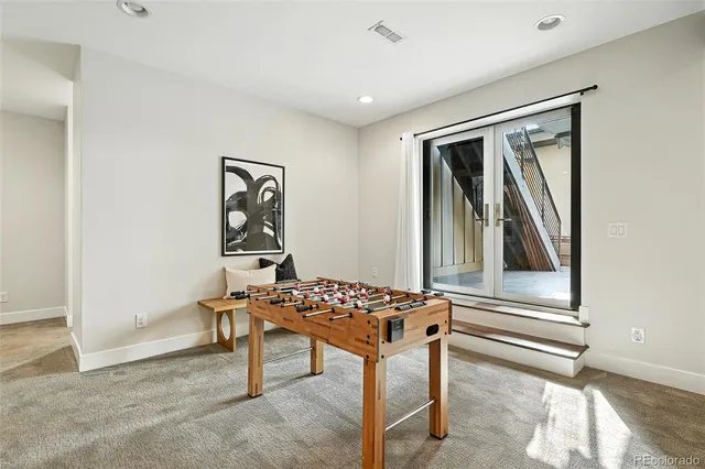 a bedroom with furniture and windows