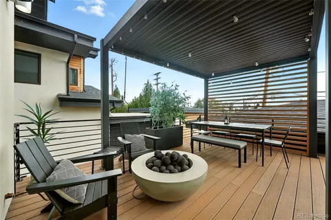 a view of a patio with a table and chairs