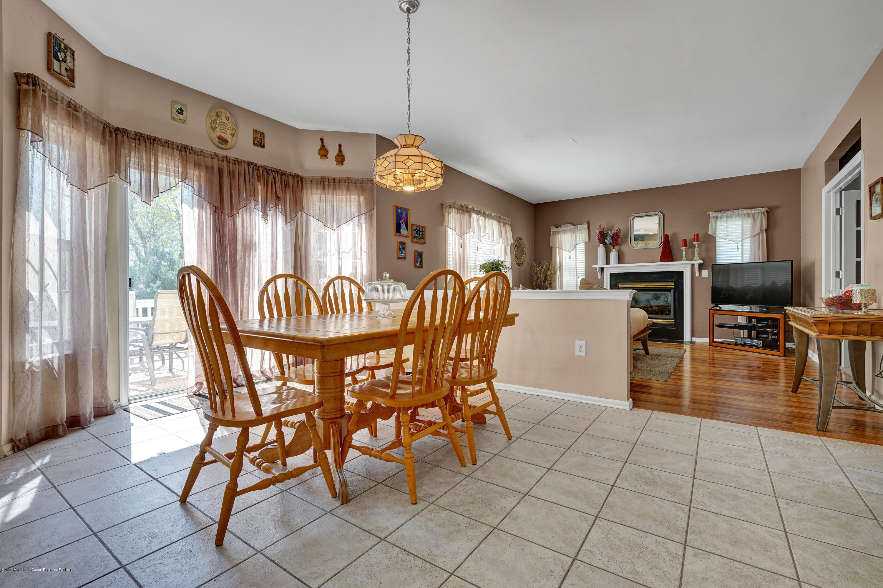 19 Cortelyou Road Jackson, NJ 08527 - Photo 15 of 56 a view of a dining room with furniture a chandelier and wooden floor