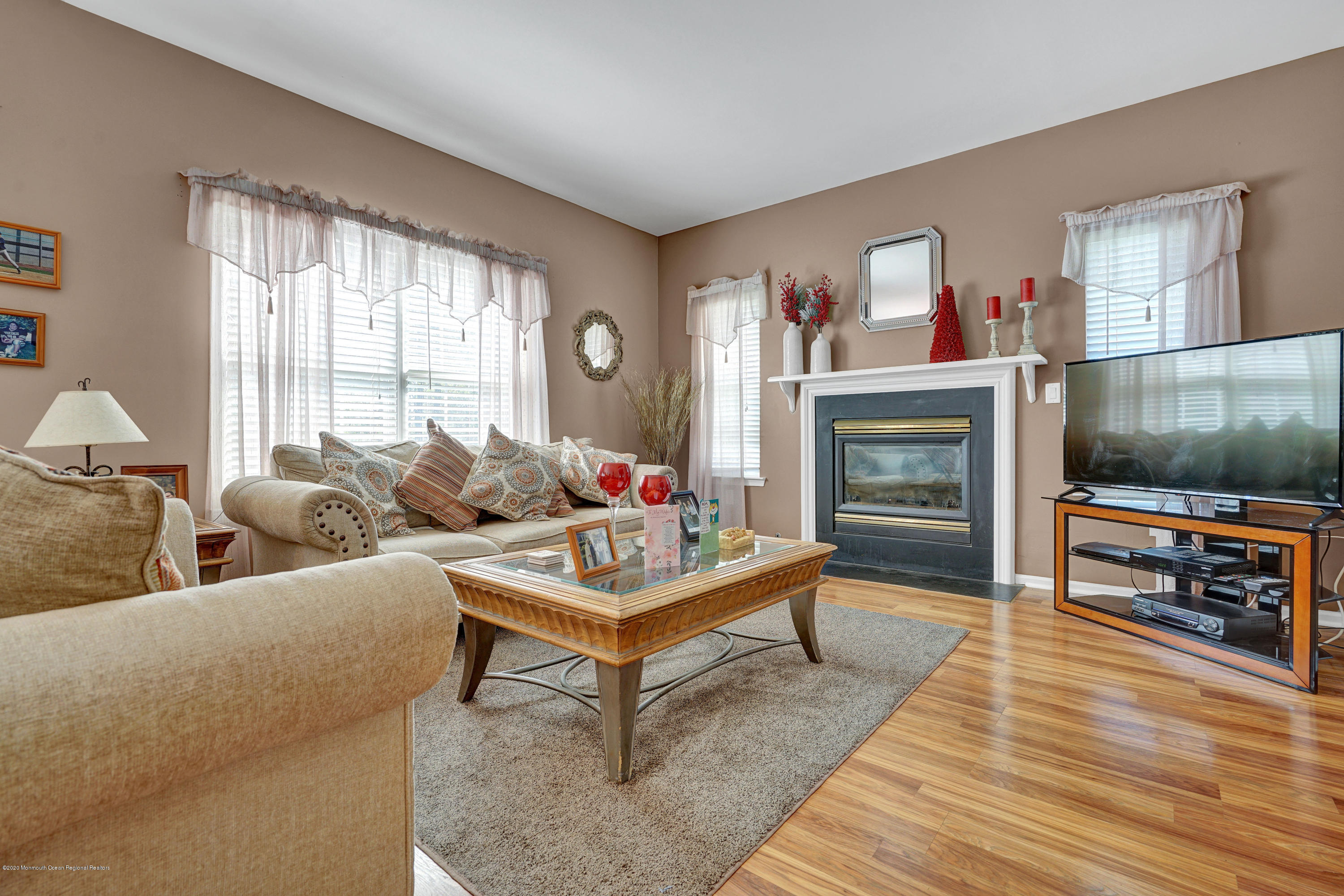 19 Cortelyou Road Jackson, NJ 08527 - Photo 17 of 56 a living room with furniture and a flat screen tv