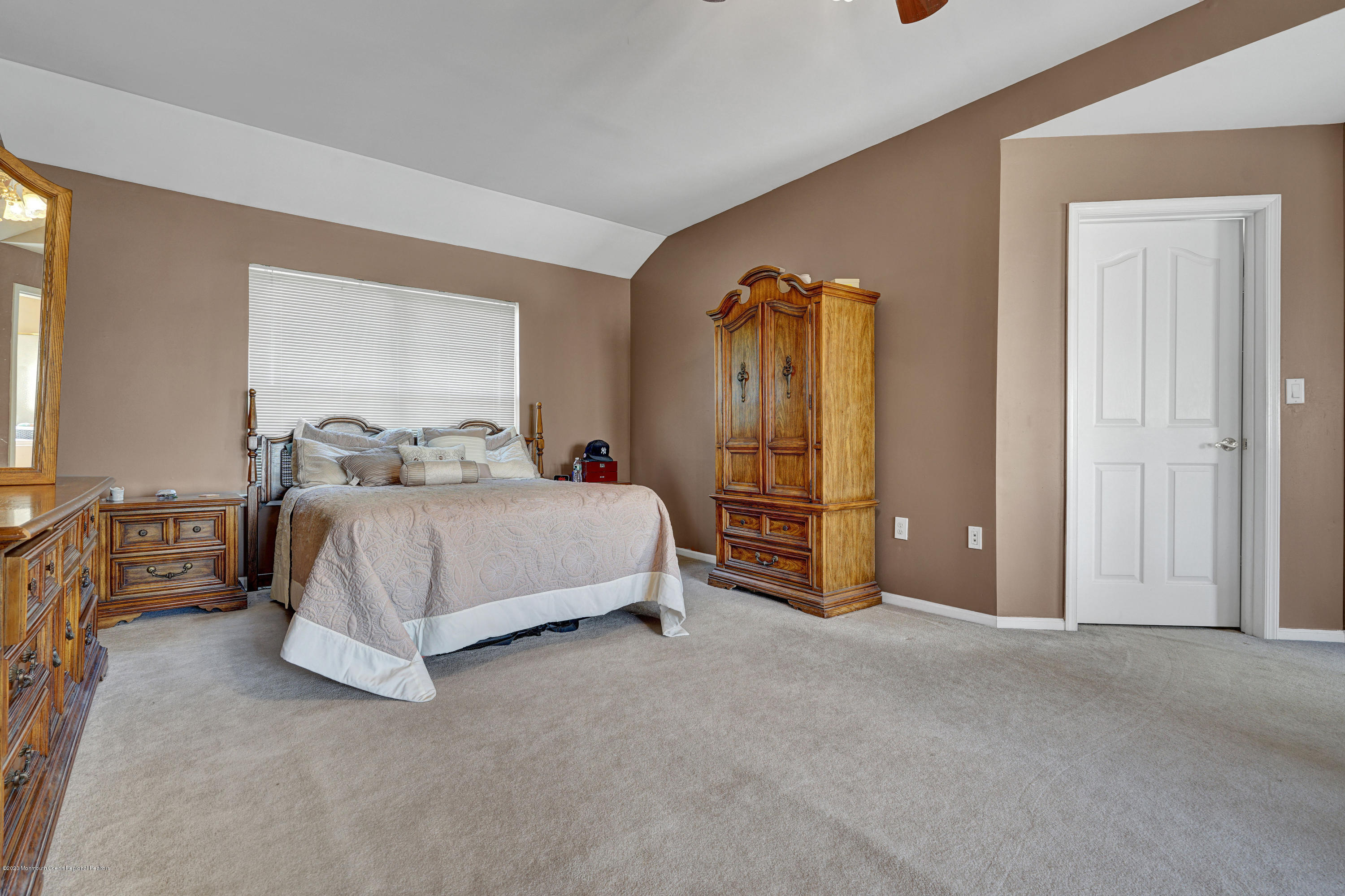 19 Cortelyou Road Jackson, NJ 08527 - Photo 27 of 56 a bedroom with a bed and dresser with mirror