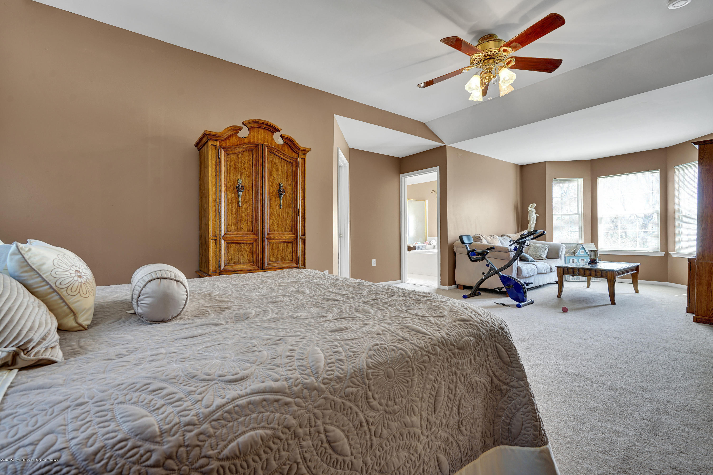 19 Cortelyou Road Jackson, NJ 08527 - Photo 28 of 56 a bedroom with a bed and a chandelier