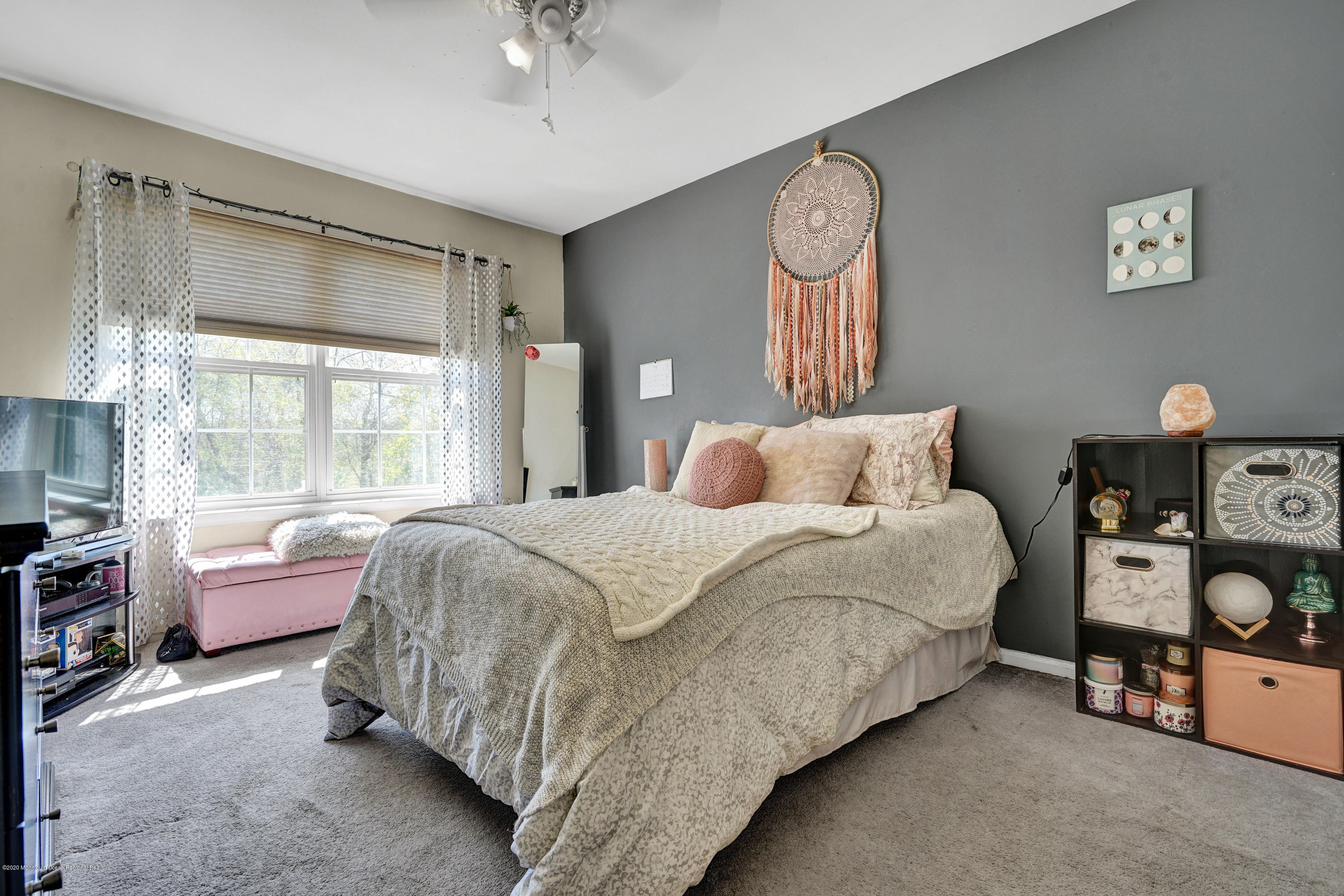 19 Cortelyou Road Jackson, NJ 08527 - Photo 32 of 56 a bedroom with a bed and a chandelier