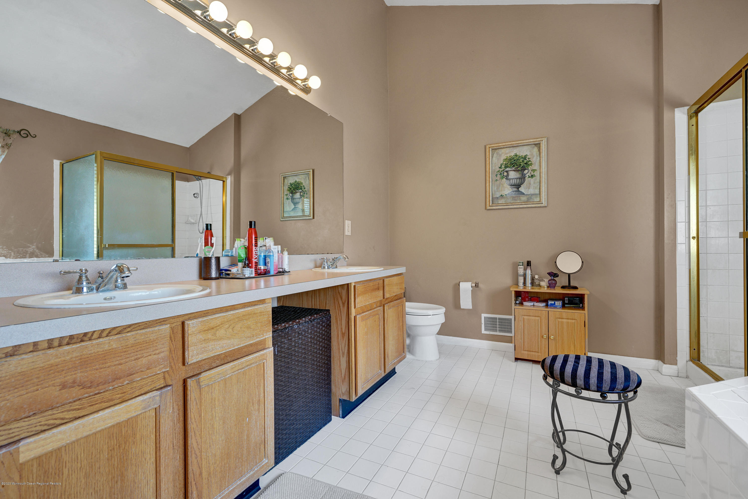 19 Cortelyou Road Jackson, NJ 08527 - Photo 34 of 56 a spacious bathroom with a double vanity sink a mirror a bathtub and a window