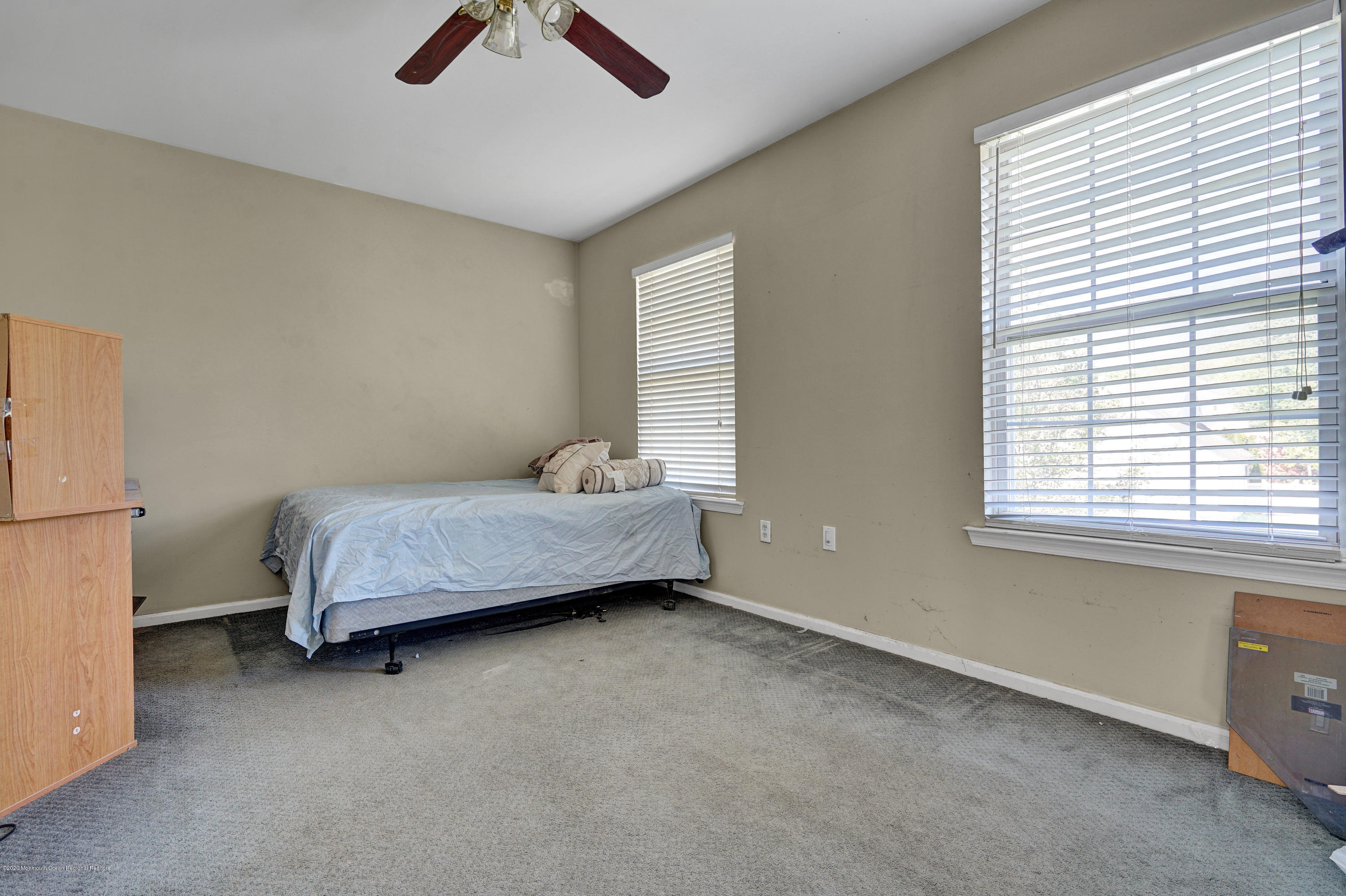 19 Cortelyou Road Jackson, NJ 08527 - Photo 37 of 56 a bedroom with a bed and a chandelier