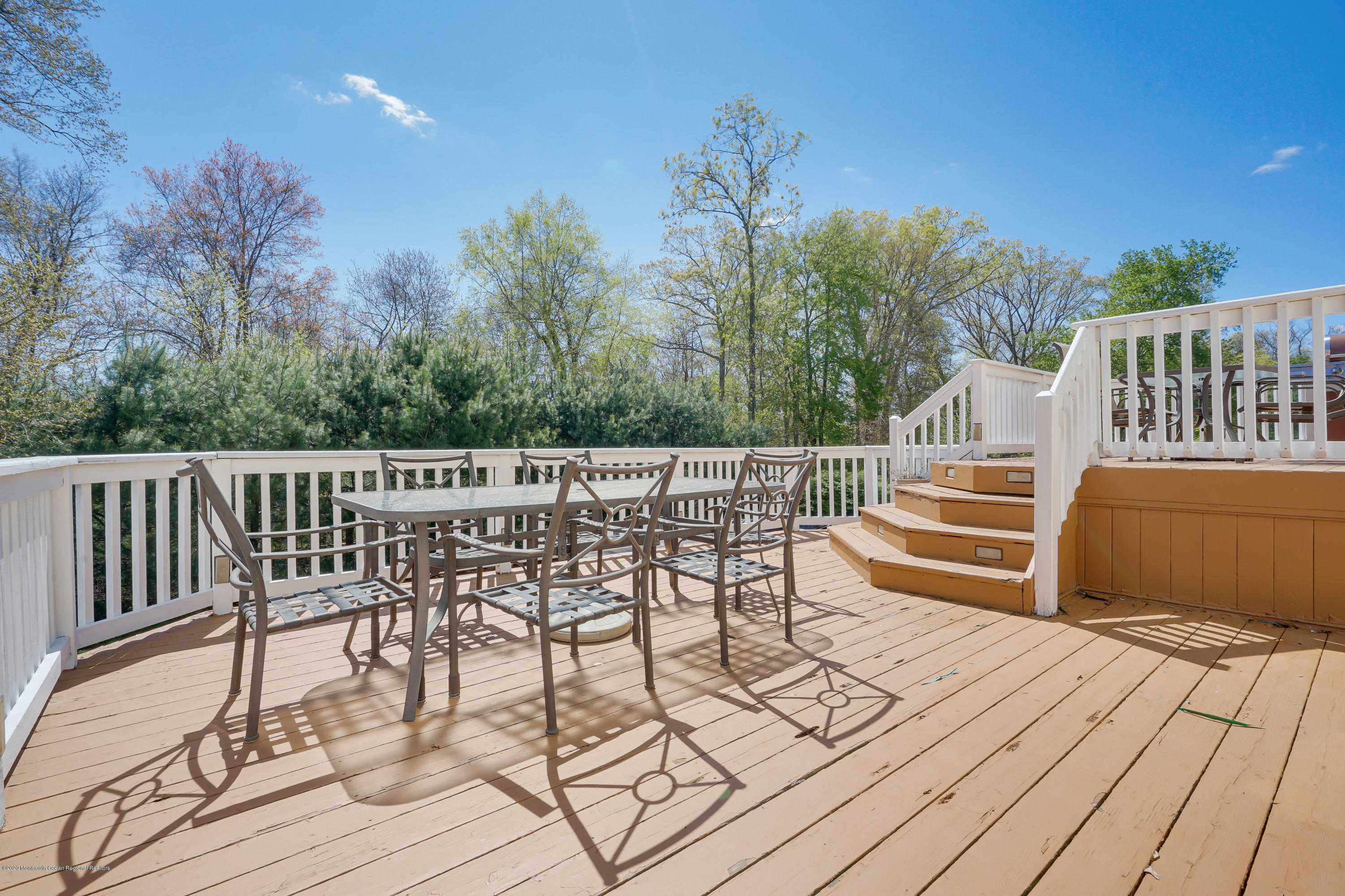 19 Cortelyou Road Jackson, NJ 08527 - Photo 6 of 56 a view of a chairs and table on the wooden floor