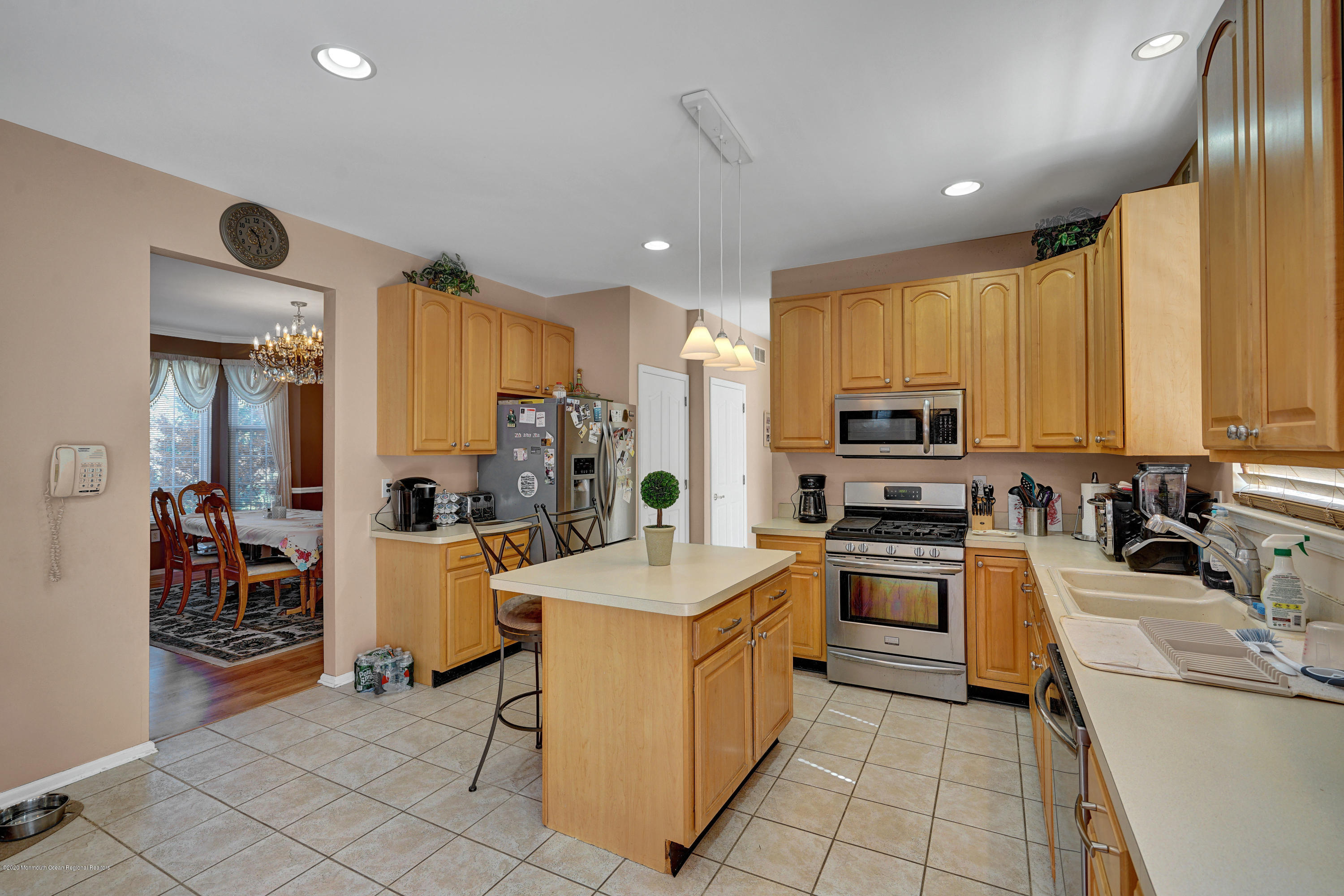 19 Cortelyou Road Jackson, NJ 08527 - Photo 9 of 56 a kitchen with stainless steel appliances a stove top oven a sink a refrigerator and cabinets