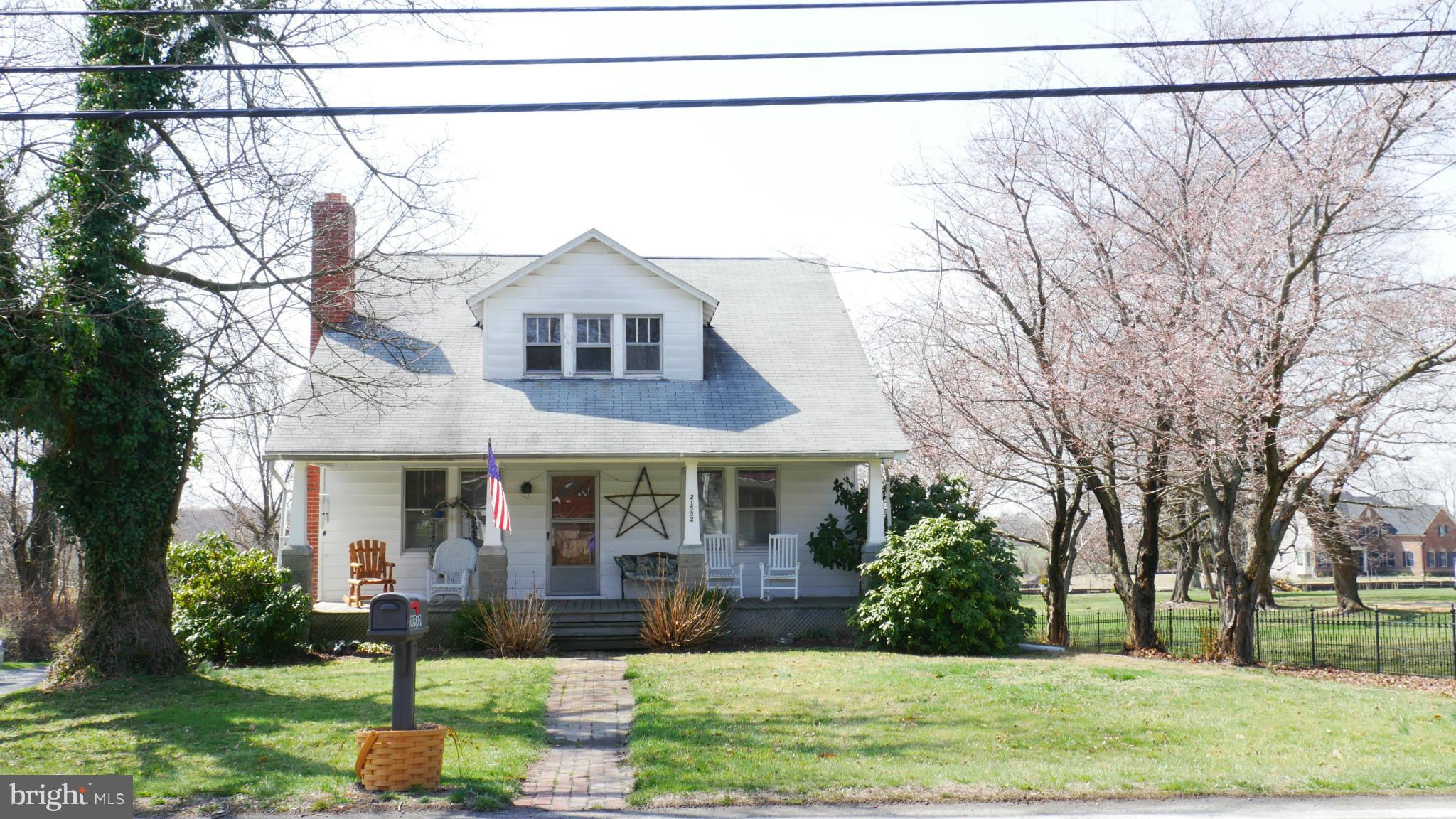 21532 Laytonsville Road Gaithersburg, MD 20882 - Photo 2 of 2 a front view of a house with a yard