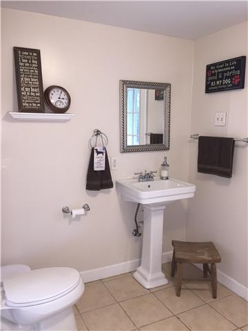 7345 Cavalier Road Nashville, TN 37221 - Photo 17 of 20 Finished basement half bath in large laundry room