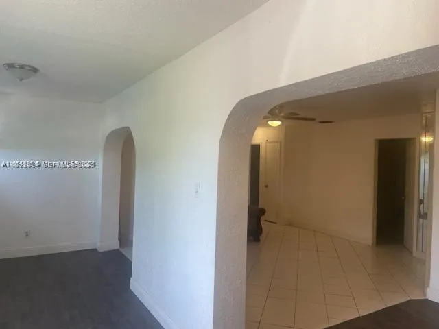 a view of a livingroom from a hallway