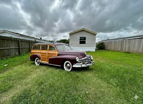 a view of a car in front of a house