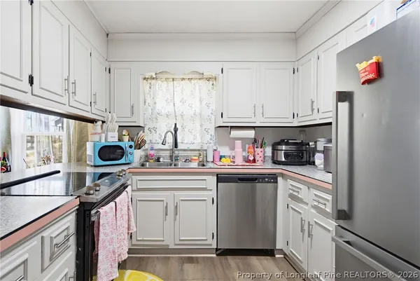 a outdoor living space with furniture and a rug