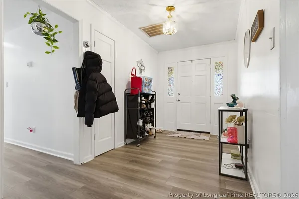 a bathroom with a sink toilet and mirror