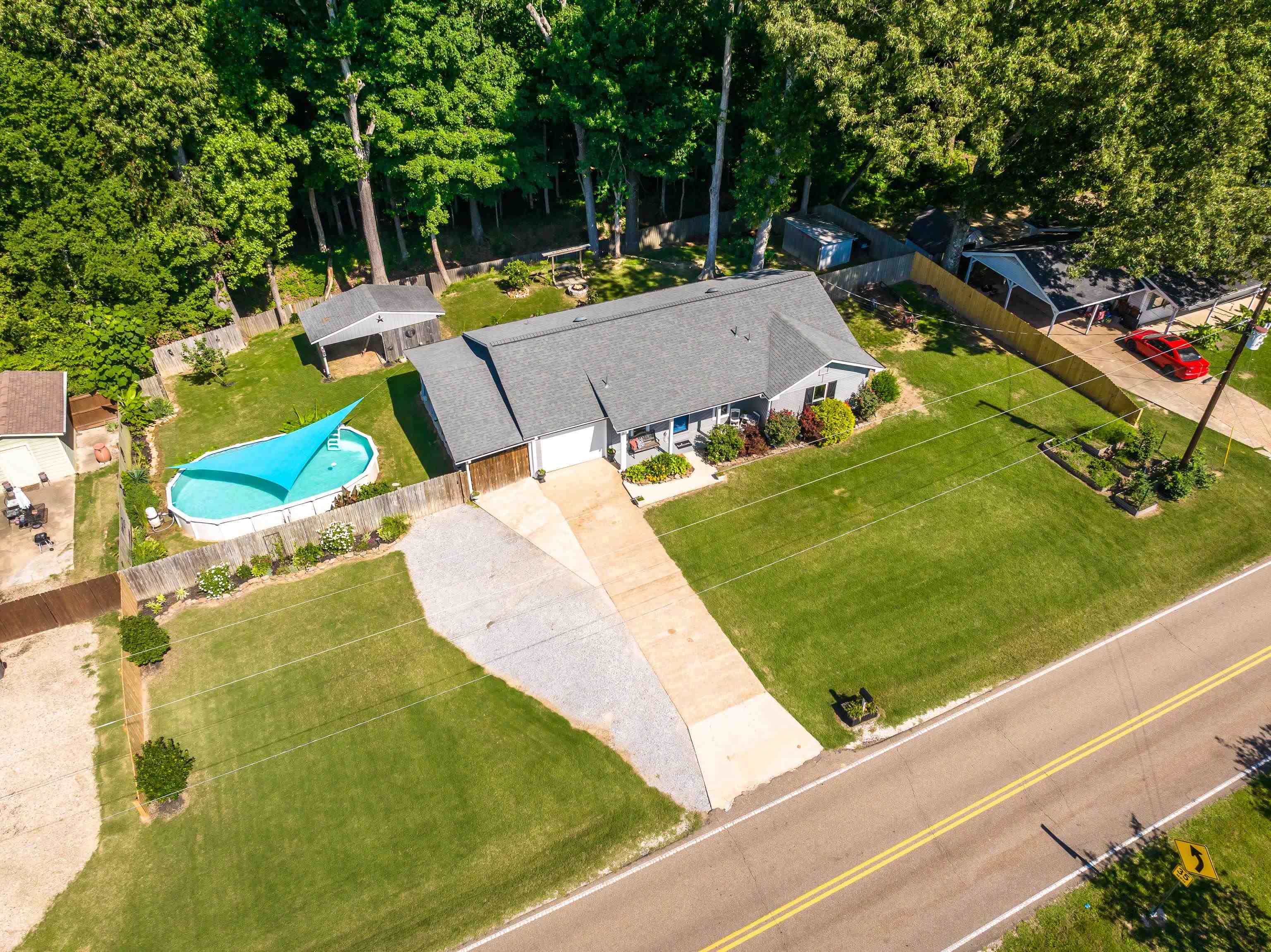 2399 Beaver Road Munford, TN 38058 - Photo 2 of 31 Expansive property featuring extra parking, garage, and a fenced backyard with an above-ground pool