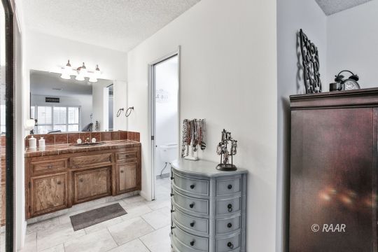 928 Randall Street Ridgecrest, CA 93555 - Photo 27 of 34 a kitchen with a sink and cabinets