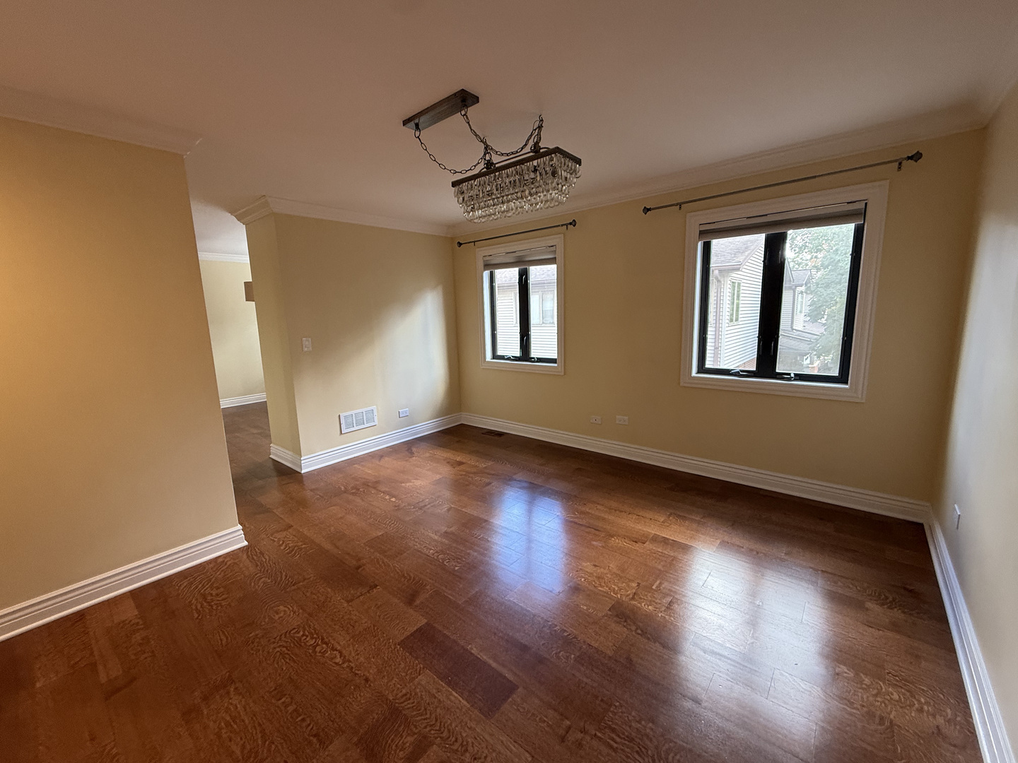 60 South Dee Road, Unit G Park Ridge, IL 60068 - Photo 13 of 23 an empty room with wooden floor and windows