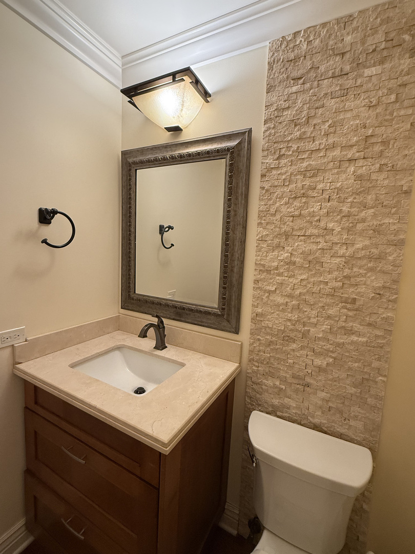 60 South Dee Road, Unit G Park Ridge, IL 60068 - Photo 7 of 23 a bathroom with a sink and a mirror