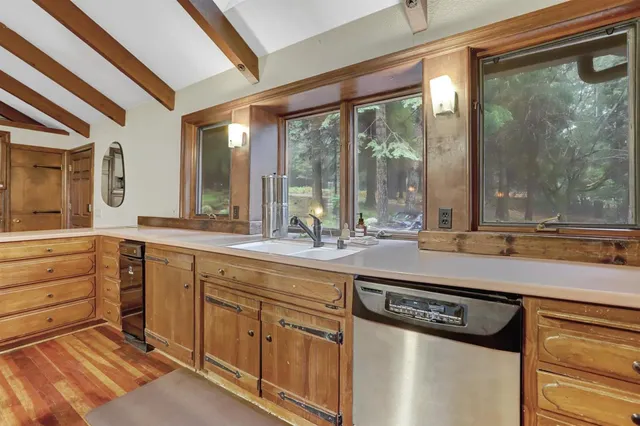 a bedroom with a large bed and a large window