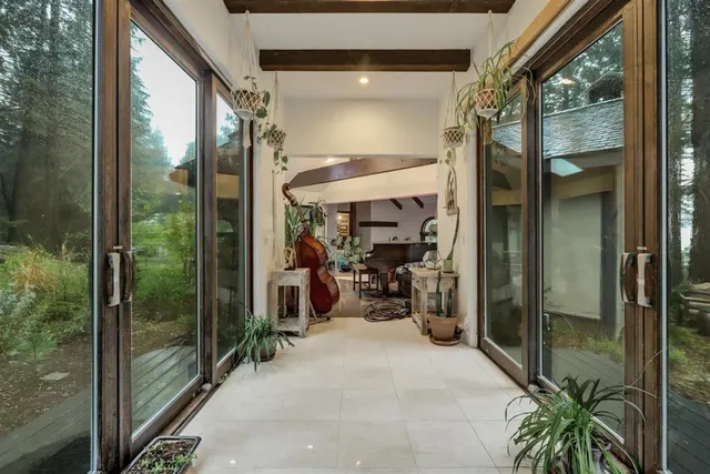a spacious bedroom with a bed and a chandelier