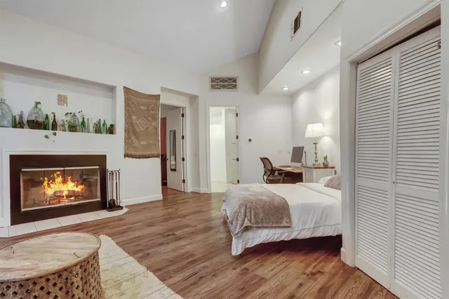 a view of a backyard with table and chairs and wooden fence