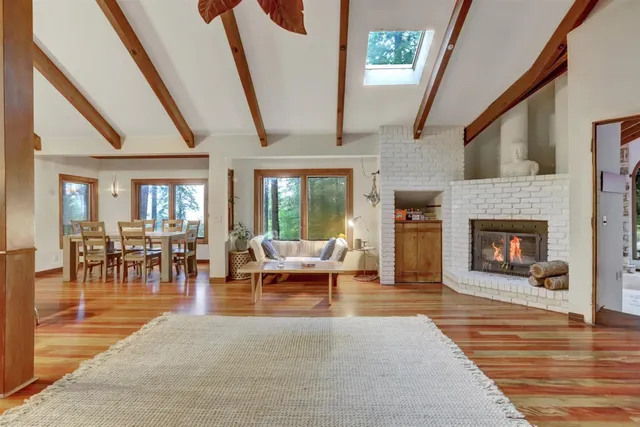 a spacious bedroom with a bed and a fireplace