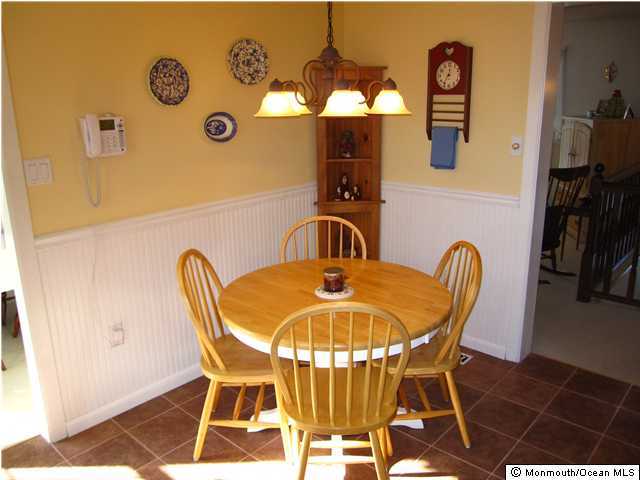 79 Hickory Hill Road Jackson, NJ 08527 - Photo 3 of 3 a dining room with furniture and a mirror