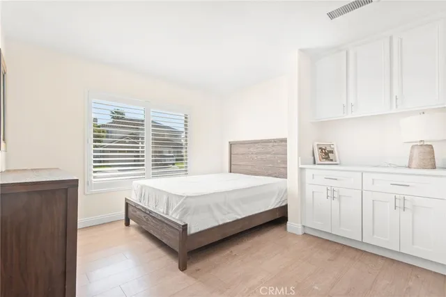a bedroom with a bed and a view of bathroom