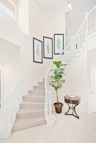 a view of a bedroom with stairs