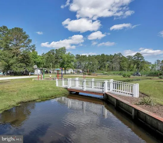 a view of a lake with a yard