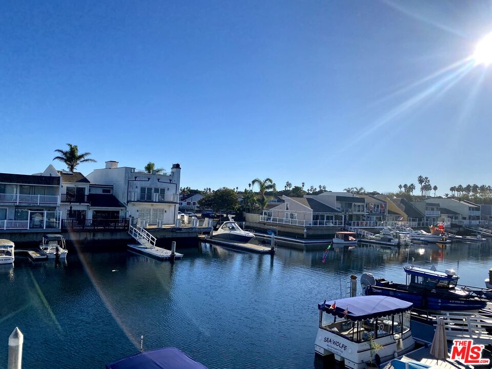 4510 Gateshead Bay Oxnard, CA 93035 - Photo 2 of 36 a view of a lake with lawn chairs