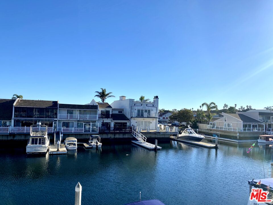 4510 Gateshead Bay Oxnard, CA 93035 - Photo 24 of 36 a view of a lake with building in front of it