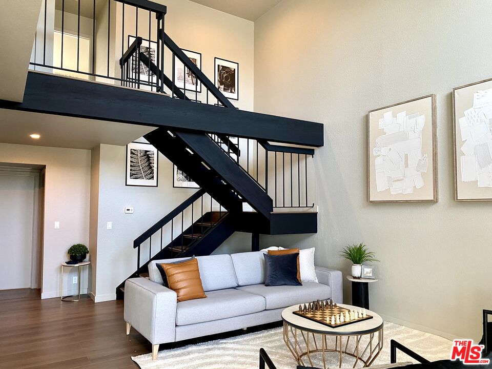 4510 Gateshead Bay Oxnard, CA 93035 - Photo 6 of 36 a living room with furniture and a wooden floor