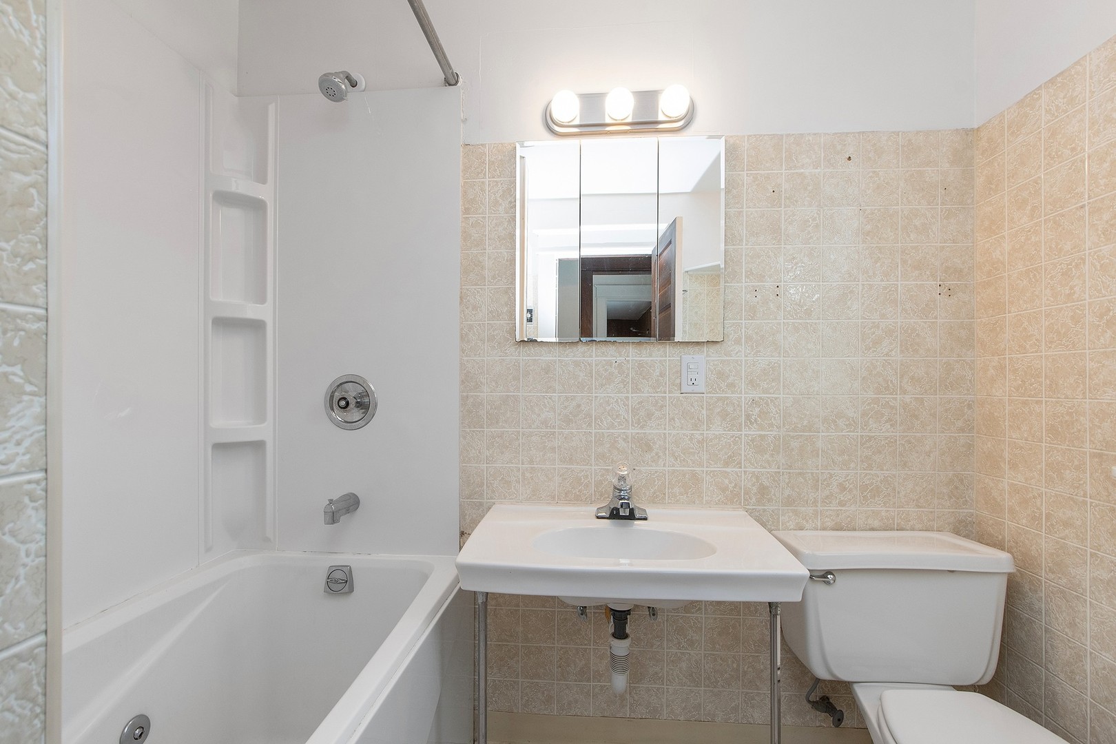1525 Burr Oak Road Homewood, IL 60430 - Photo 13 of 20 a bathroom with a sink a toilet and shower