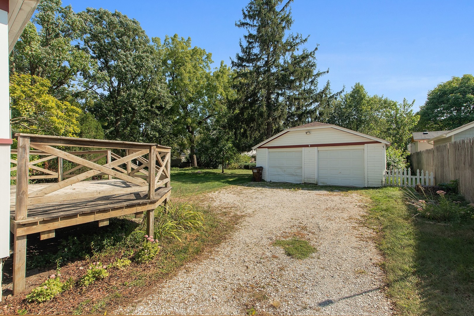 1525 Burr Oak Road Homewood, IL 60430 - Photo 19 of 20 a backyard of a house with large trees and outdoor seating