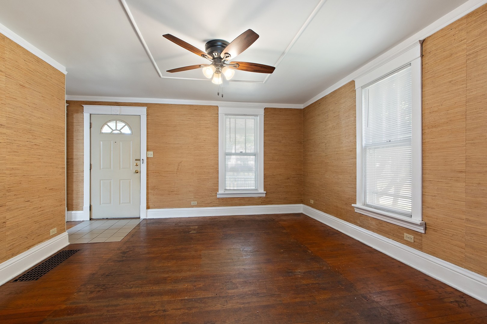 1525 Burr Oak Road Homewood, IL 60430 - Photo 5 of 20 a view of an empty room with wooden floor and a window