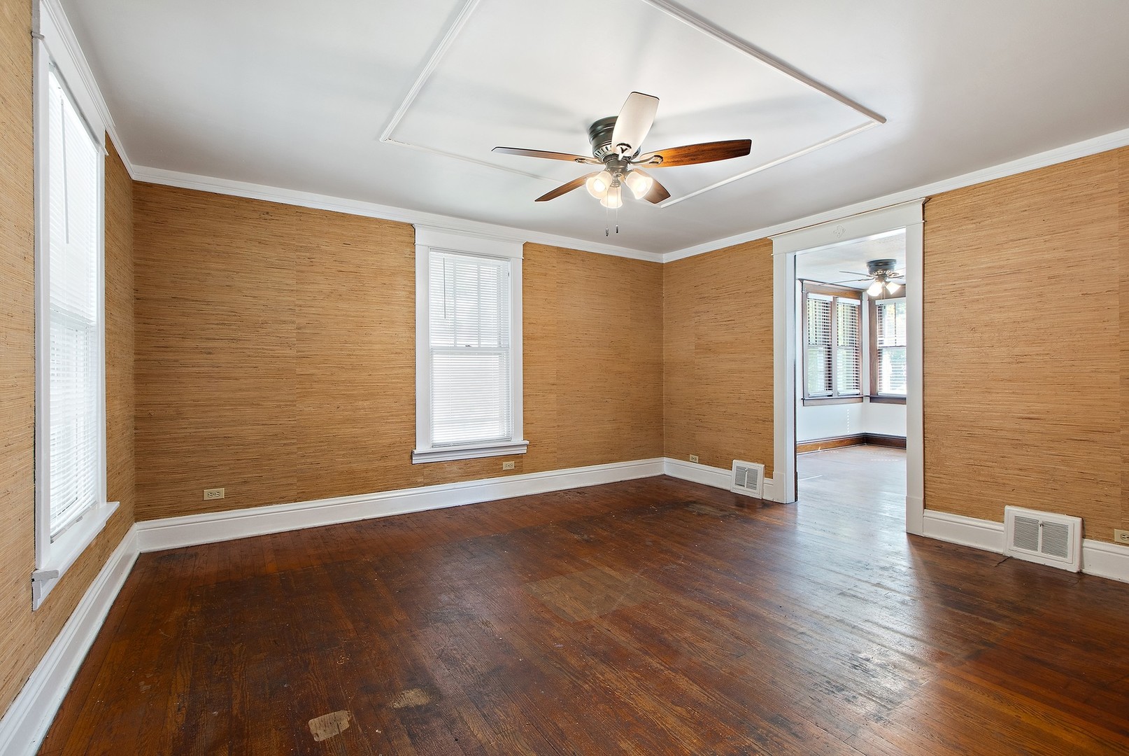 1525 Burr Oak Road Homewood, IL 60430 - Photo 6 of 20 a view of an empty room with wooden floor and a window