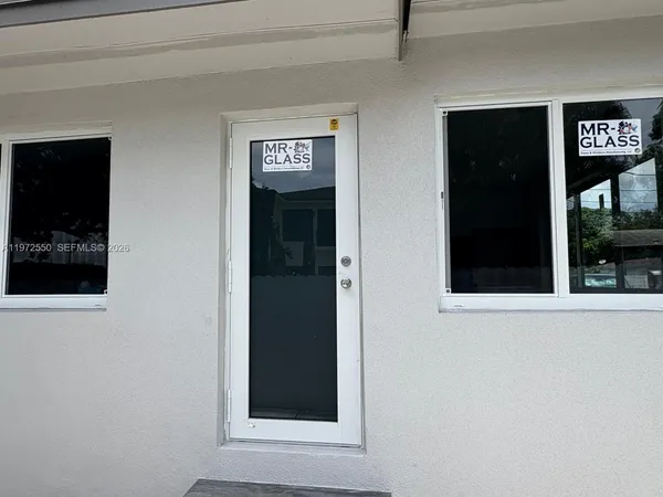 a view of a door and a window