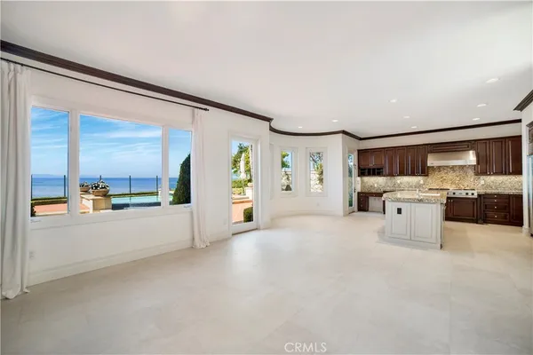 a kitchen with stainless steel appliances granite countertop a stove and a refrigerator