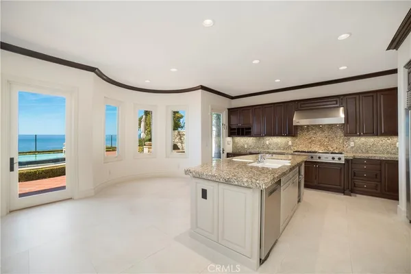 a view of kitchen with furniture and large window